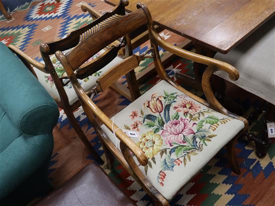 A pair of Regency rosewood and simulated rosewood elbow chairs, with drop in tapestry seats